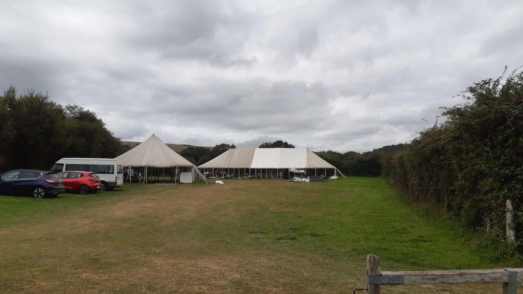 Big marquees half finished with posts showing.